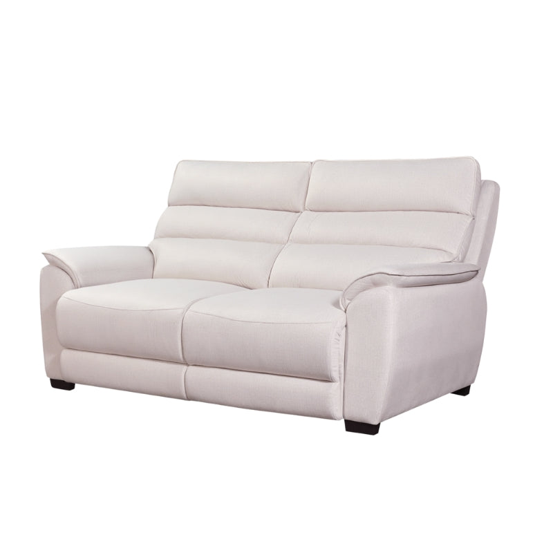 White sofa in a living room with wooden coffee table and side table.