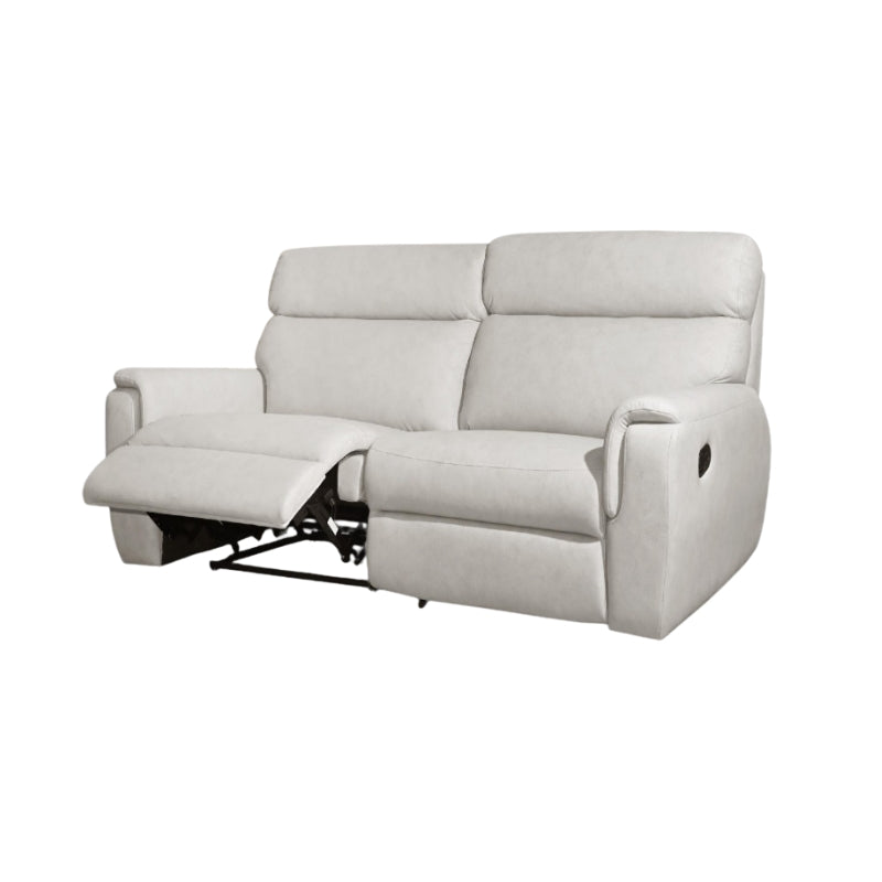 White recliner sofa in a living room setting with a wooden coffee table and decor items.