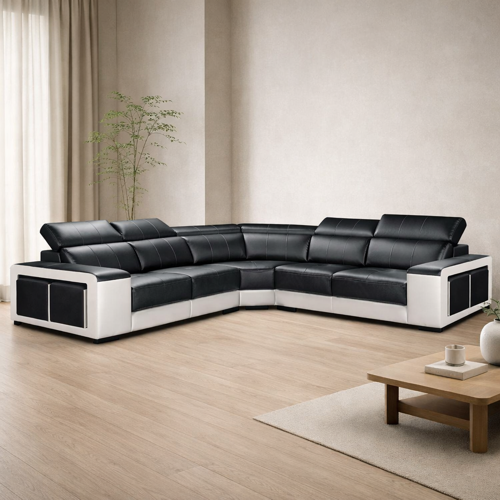 Black and white sectional sofa in a modern living room with a wooden coffee table and plant.