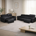 Modern living room with black leather sectional sofa and wooden coffee table.