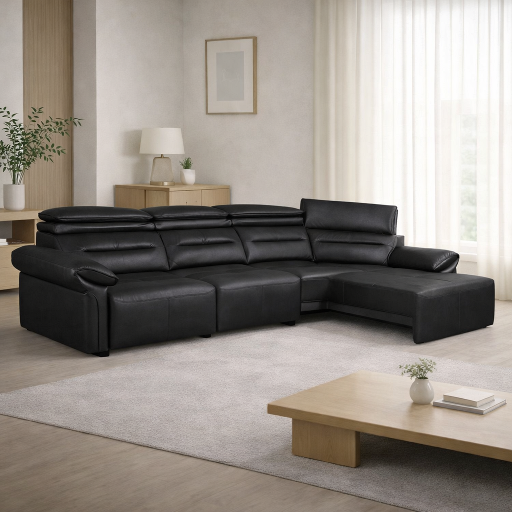 Black leather sectional sofa in a modern living room with a wooden coffee table and decorative items.
